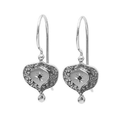 A pair of sterling silver earrings with an oxidised finish, featuring hand engraved scrolls and round cut natural black diamonds.