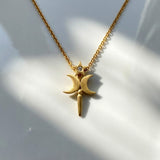 Gold necklace with a star and moon pendant on a white background