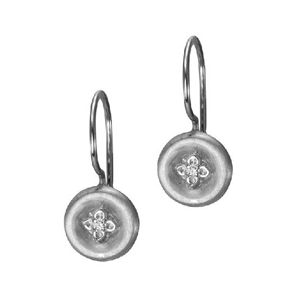 A pair of sterling silver earrings with a round shape and a central diamond design, suspended by silver hooks.